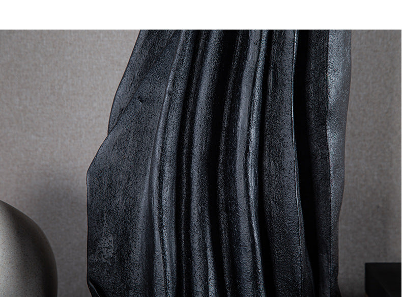 Detail of matte black resin texture and folds