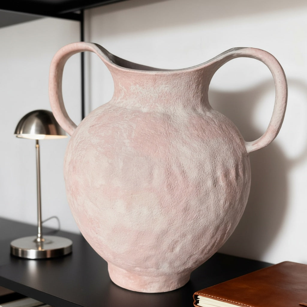 Close up of empty textured blush ceramic vase showing handle detail