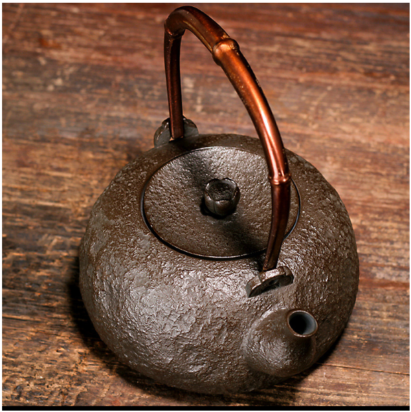 High angle view of teapot lid and handle detail