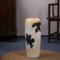 Textured ceramic vase with abstract black pattern and beige gradient