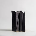 Matte black ceramic slab vase front view