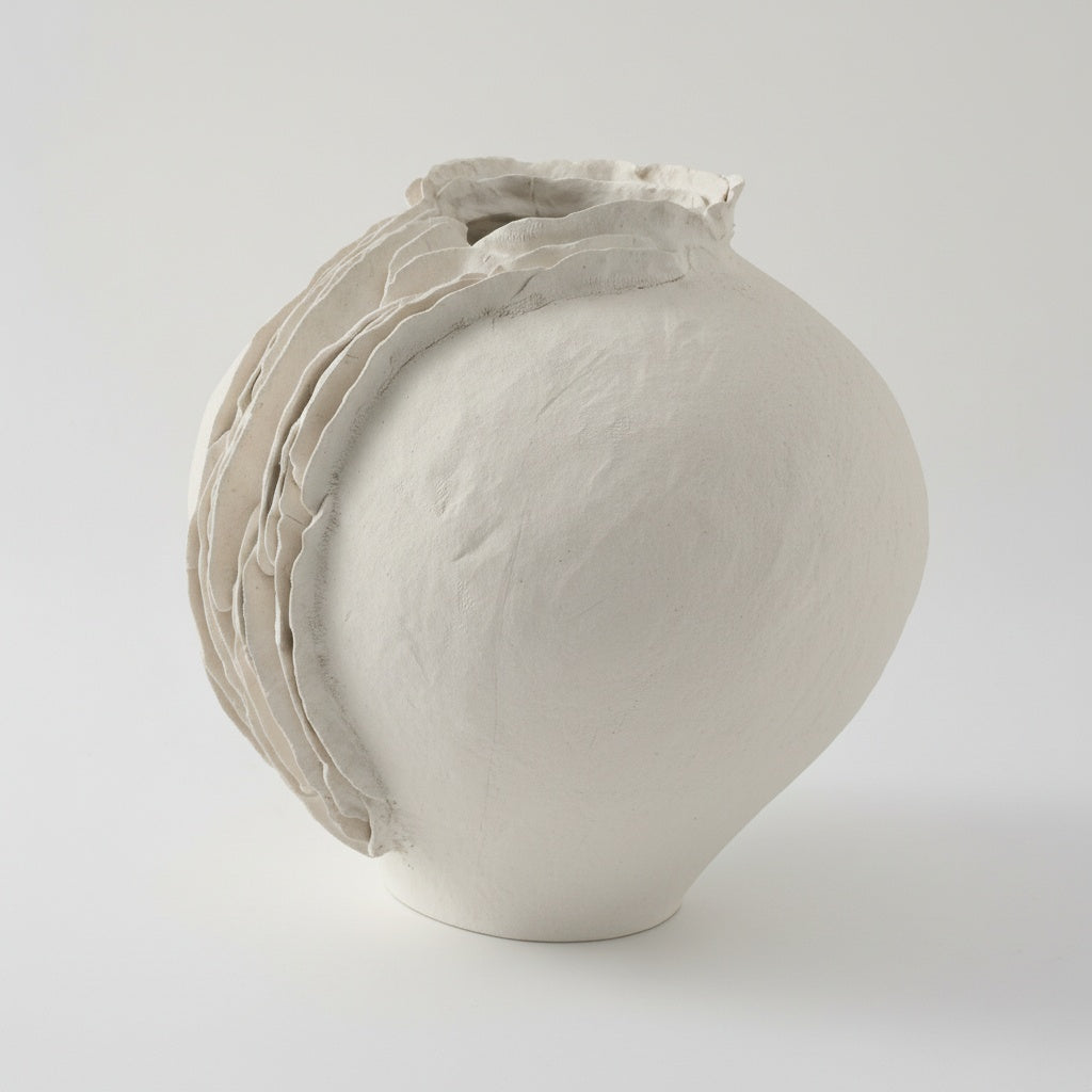 Matte white ceramic vase with textured ruffled edge