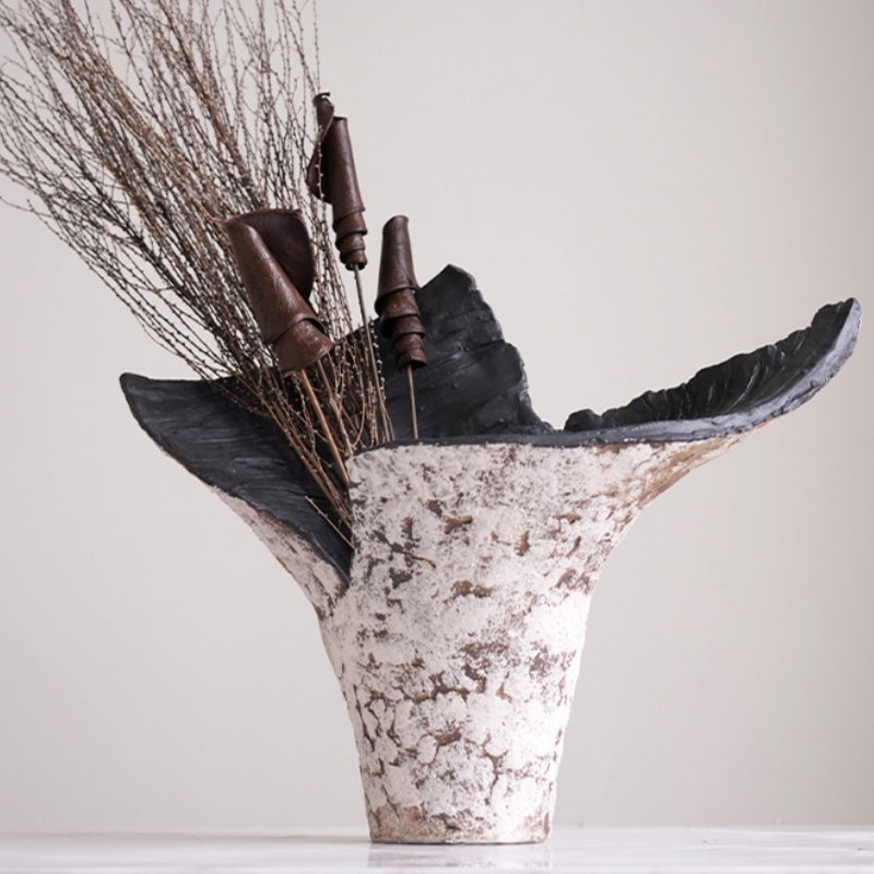 Textured ceramic vase styled with dried branches