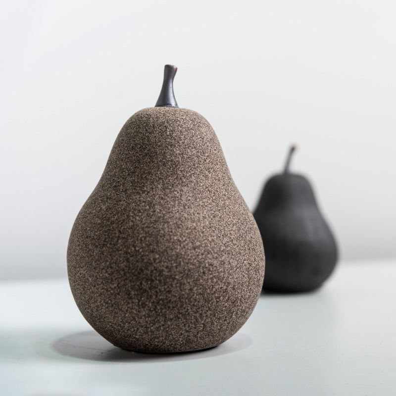 Close up of organic textures on ceramic pear figurines