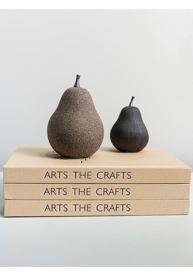 Small matte black ceramic pear isolated