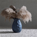 Dark textured vase with dried pampas grass
