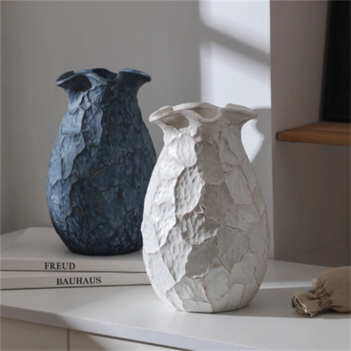 Pair of textured ceramic vases in black and white