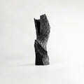 Black textured ceramic sculptural vase with jagged rock design