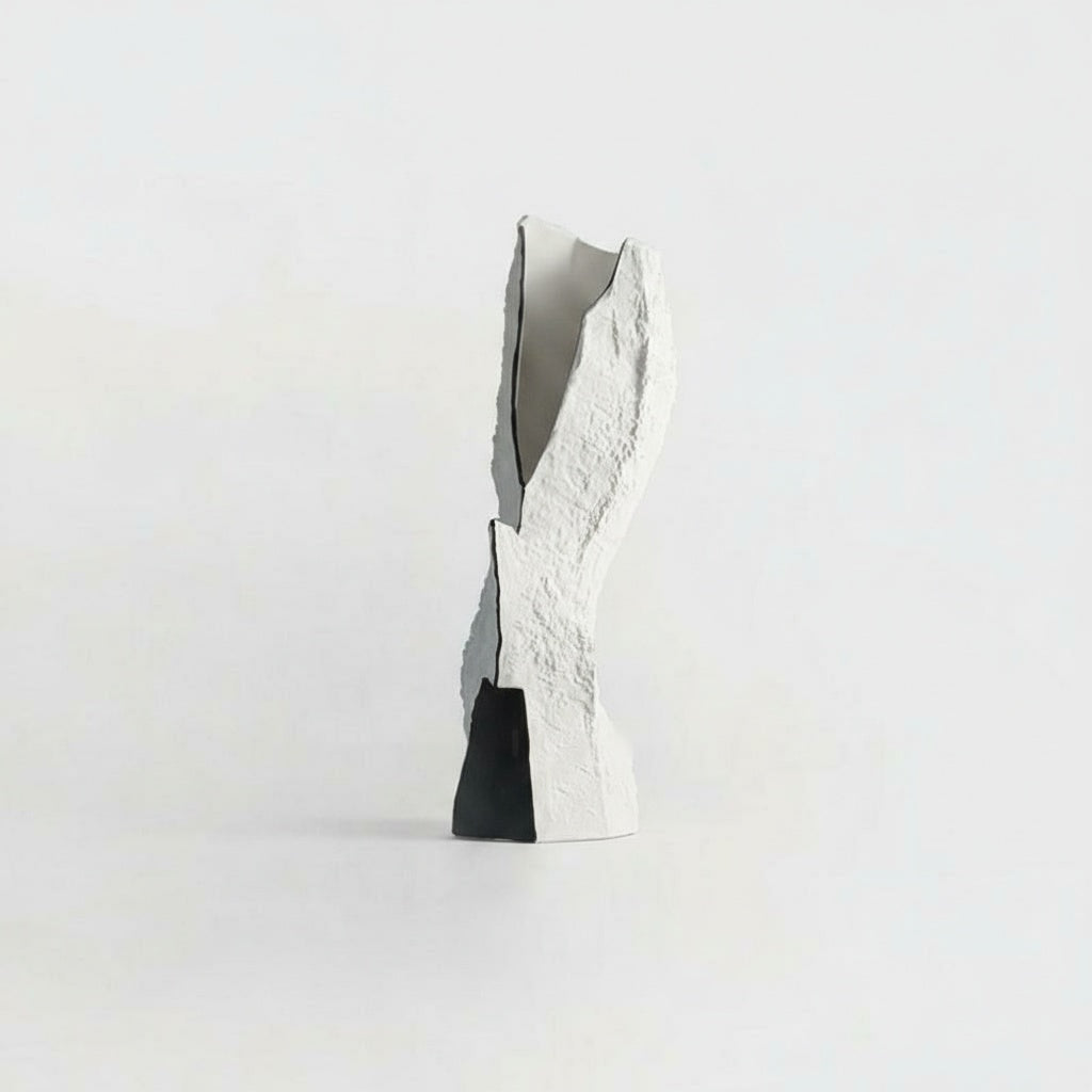 White textured ceramic sculptural vase with black base detail