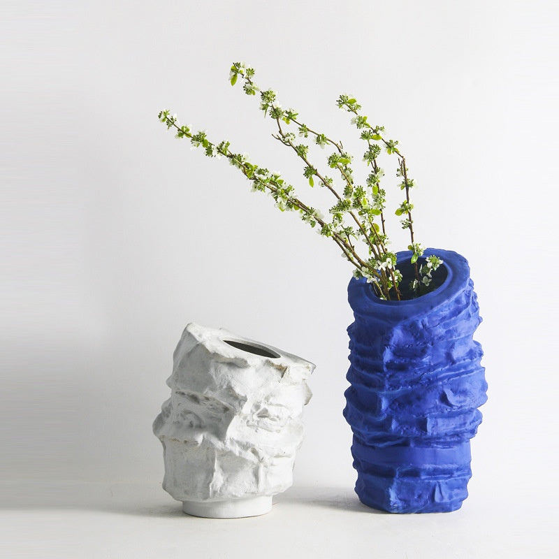 lue and white textured vases with flowers