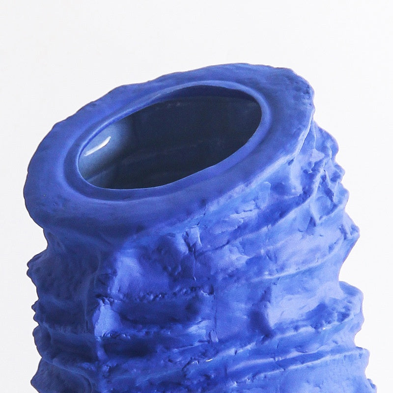 Detail of blue ceramic vase rim and texture