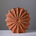 Front view of matte terracotta radial vase