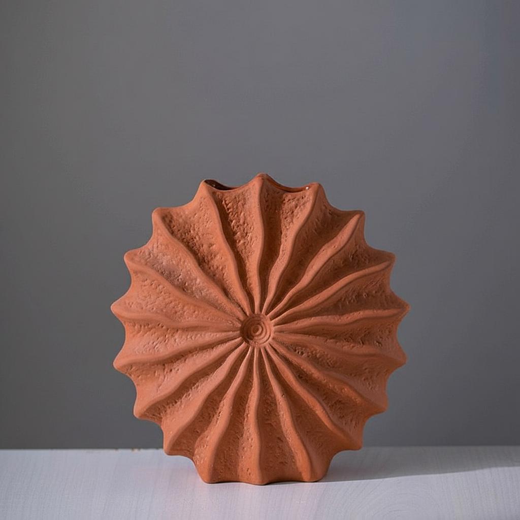 Detailed front view of sunburst ceramic vase