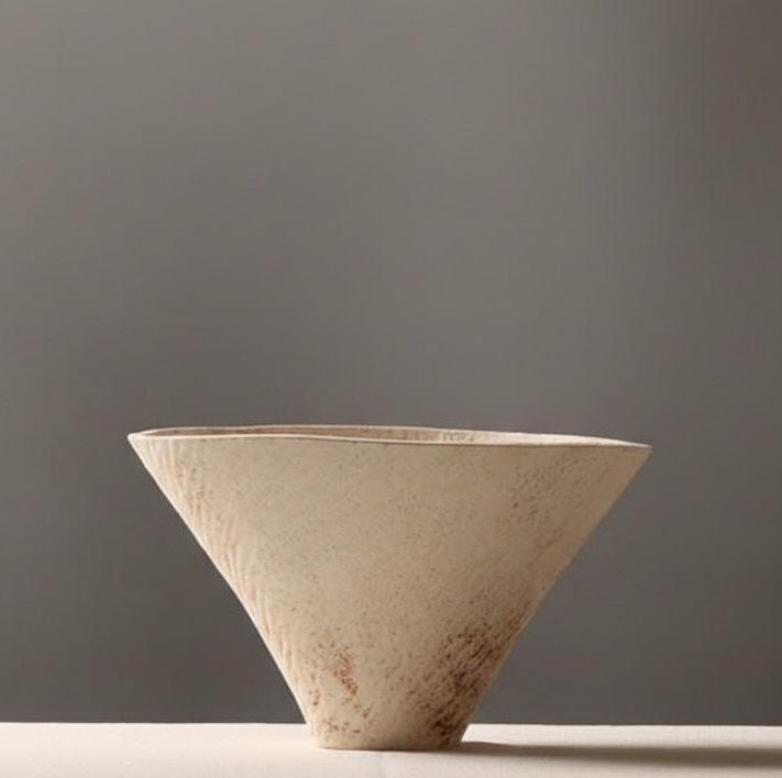 Detail of conical ceramic bowl with textured surface
