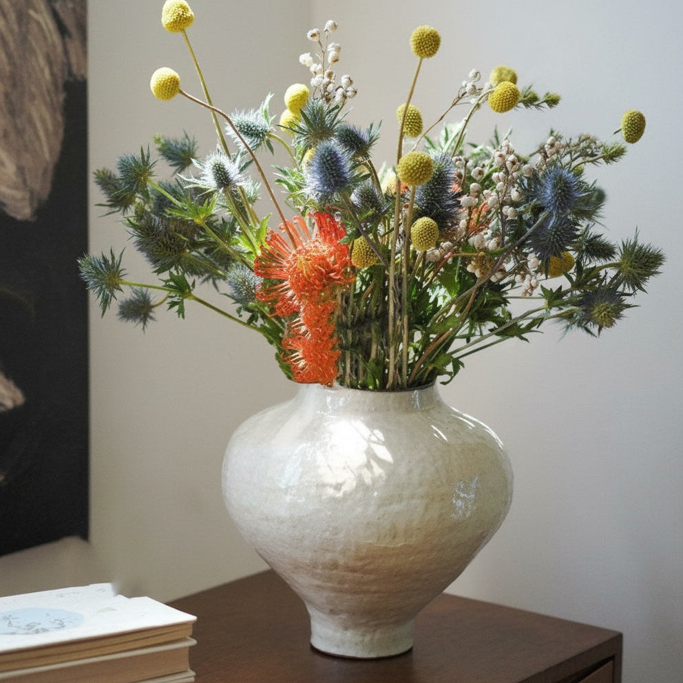 Textured Cream Sculptural Ceramic Vase on Table