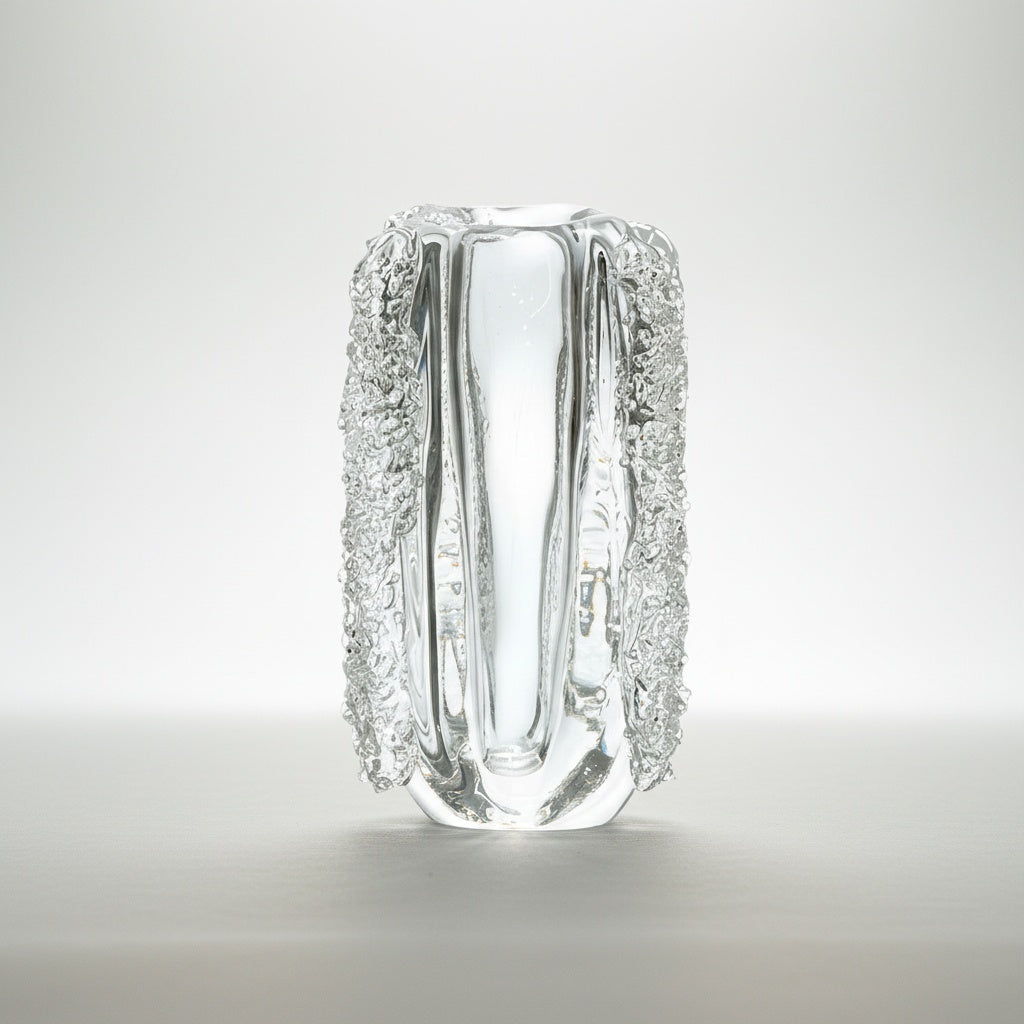Angled view of sculptural glass vase with rough ice texture