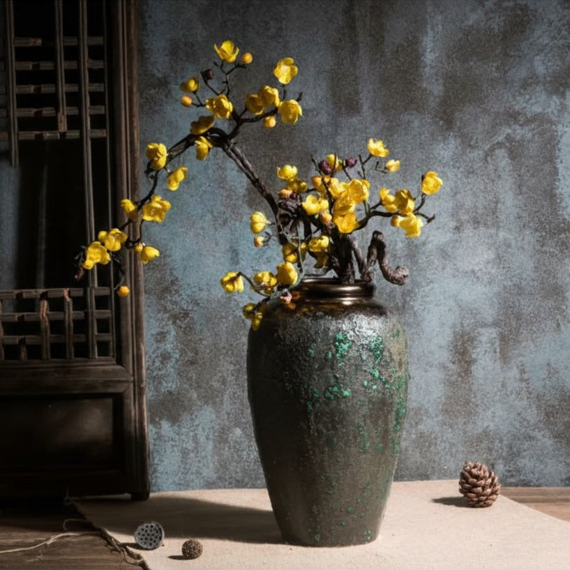 Textured dark ceramic tapered vase with yellow flowers