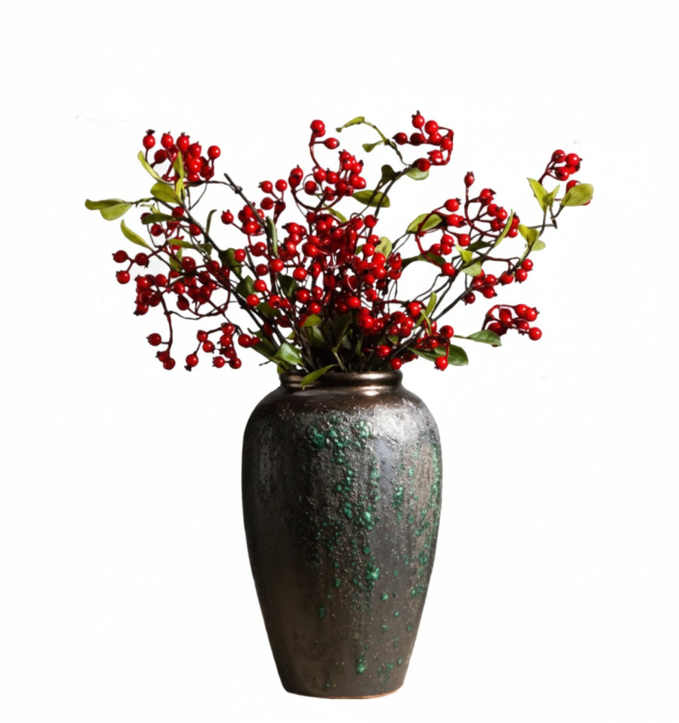 Textured dark ceramic tapered vase with red berries