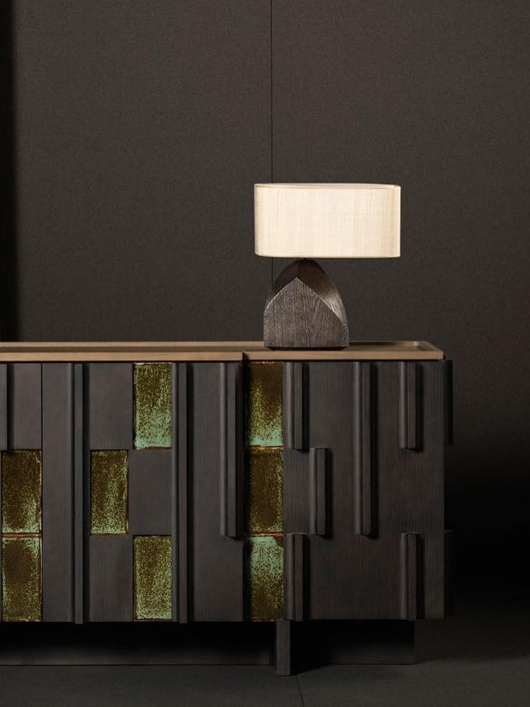 Textured resin lamp on sideboard with ambient lighting
