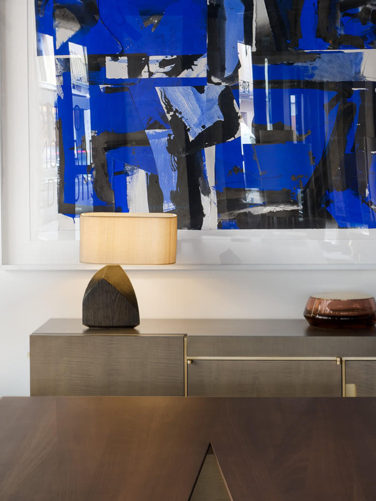 Lifestyle view of faceted table lamp in modern living room