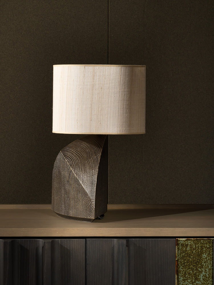Side profile of dark resin geometric lamp base
