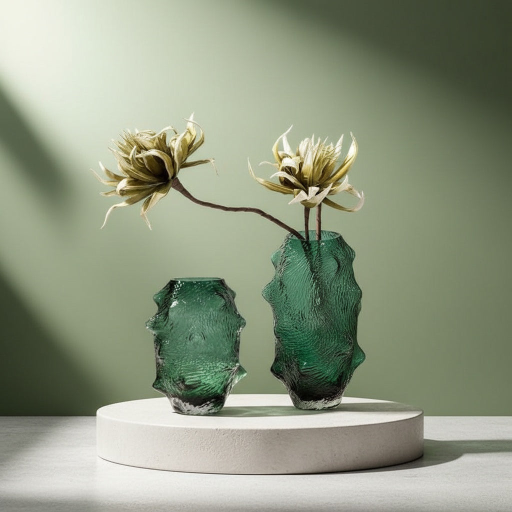 Styled emerald green textured glass vases with floral arrangement