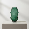 Large textured emerald green glass vase isolated
