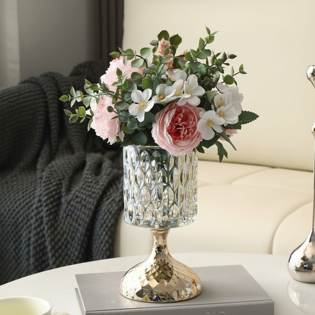 Textured glass and gold pedestal vase with pink floral arrangement