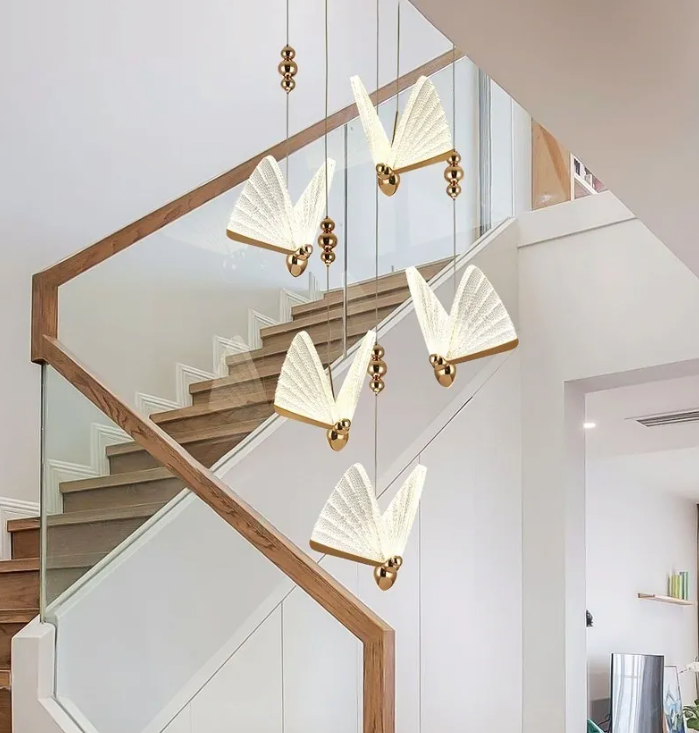 Cascading cluster of butterfly lights on staircase