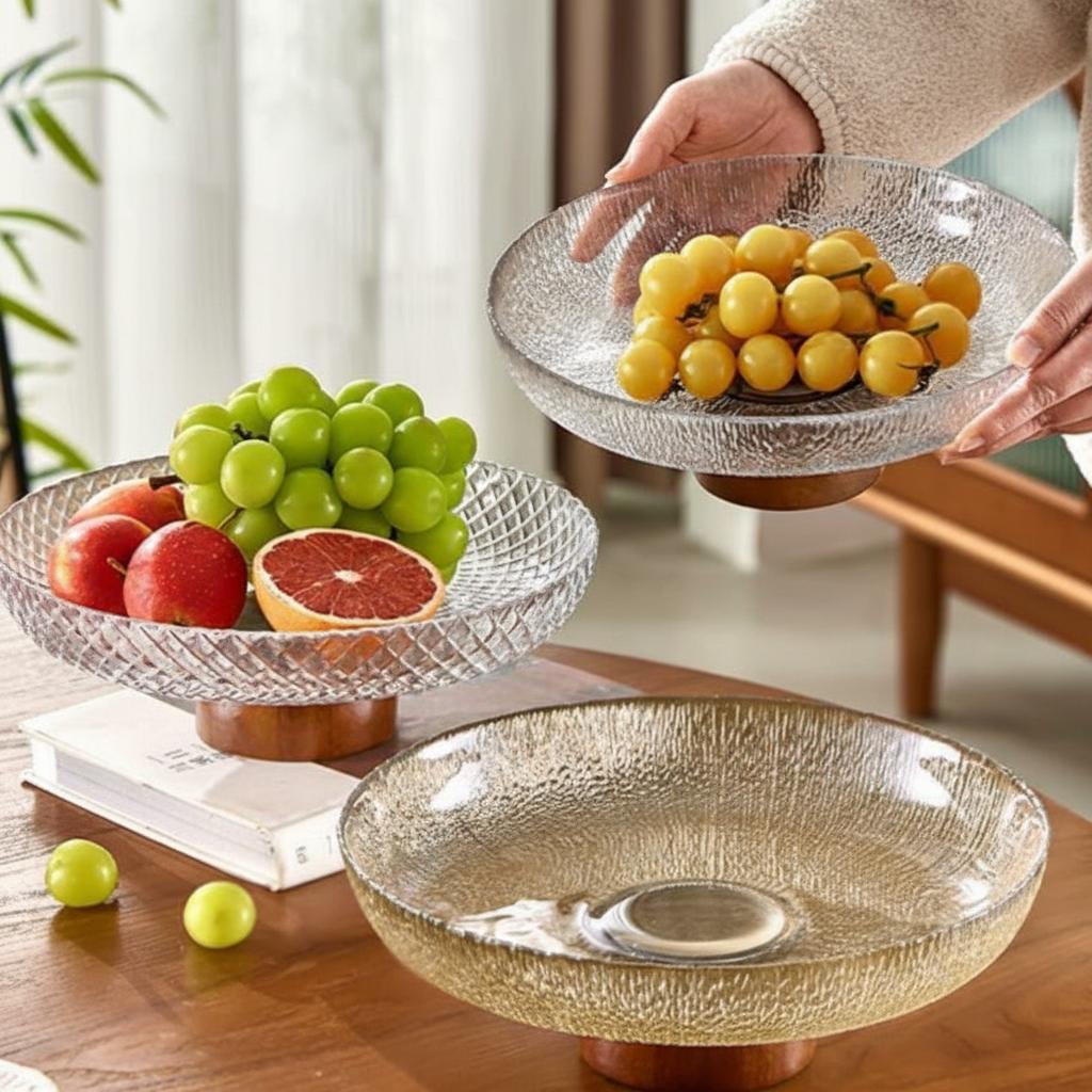Person holding clear textured glass fruit bowl