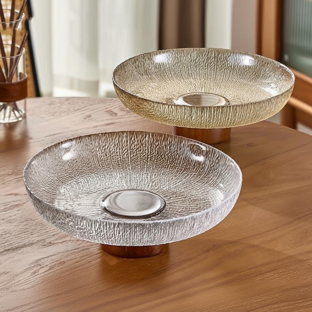 Amber and clear glass pedestal bowls on table