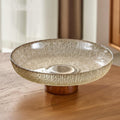 Amber textured glass bowl on wood base