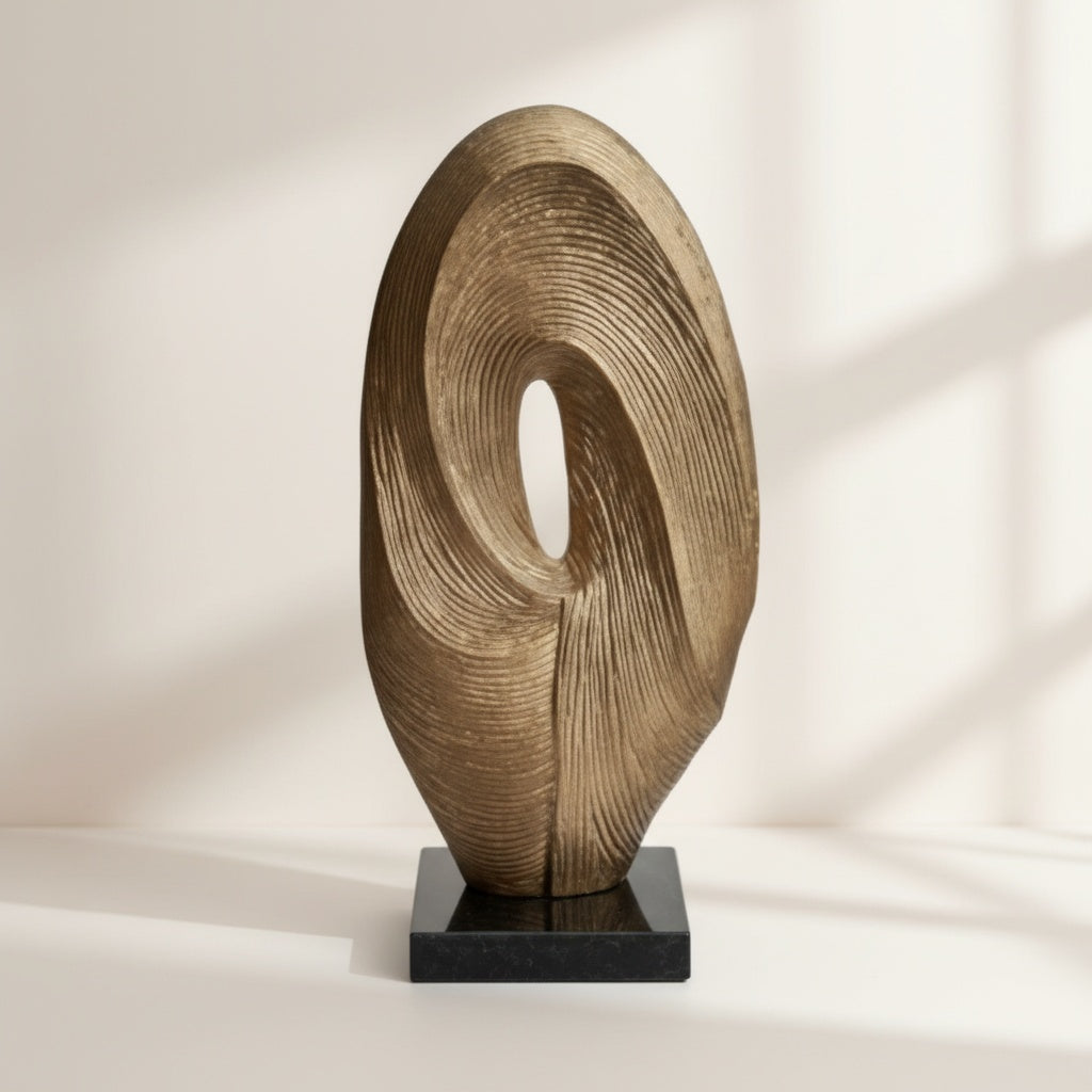 Textured gold twisted oval sculpture front view