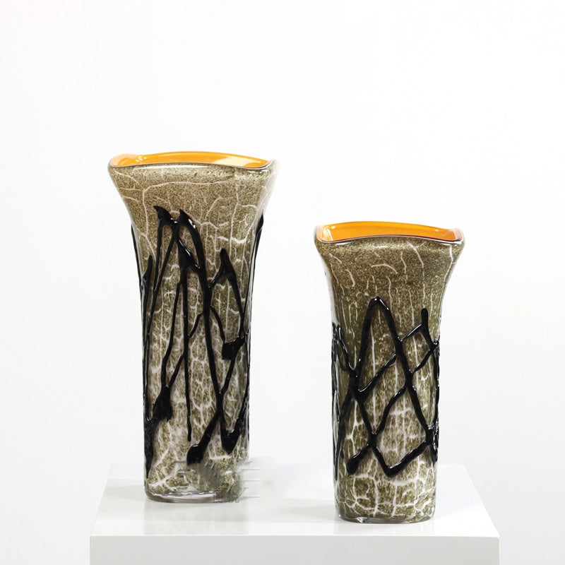 Group shot of large and medium textured green glass vases with black relief