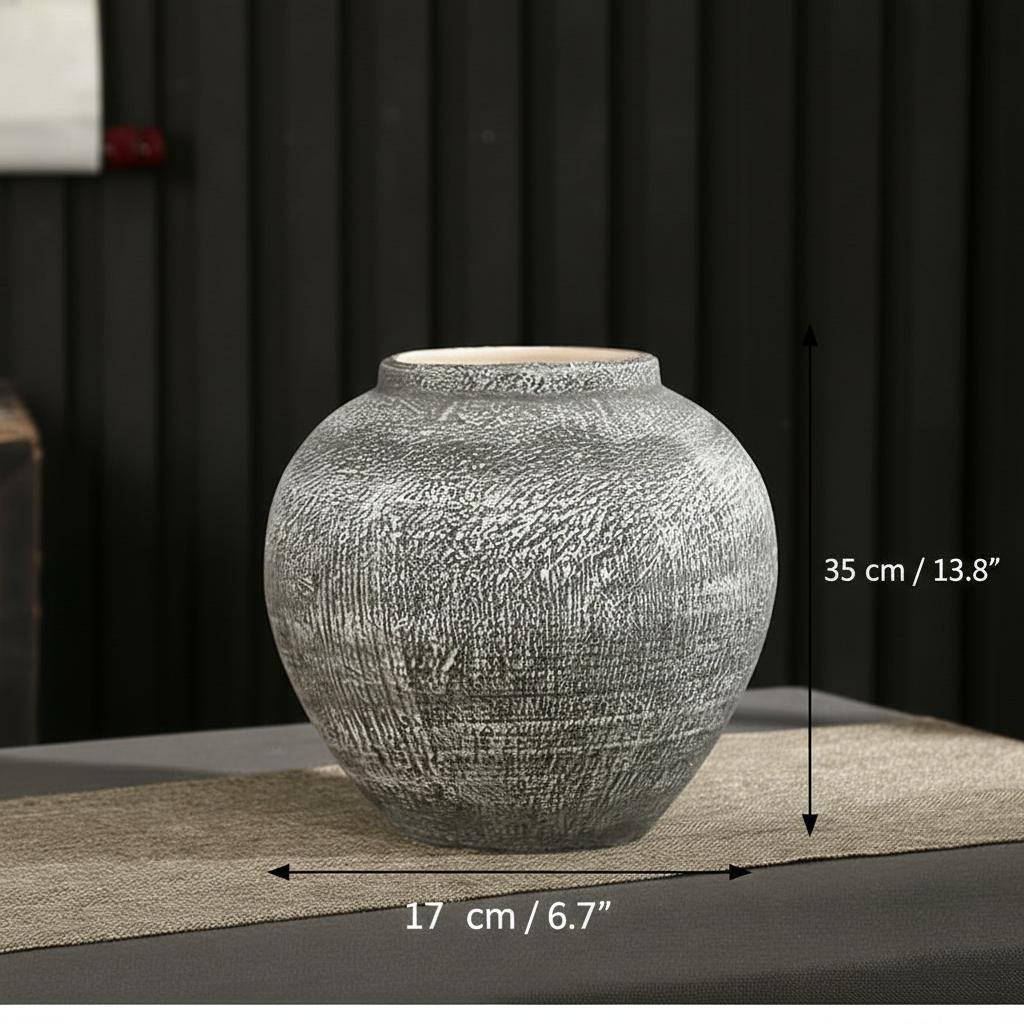 Tall grey textured ceramic vase side view