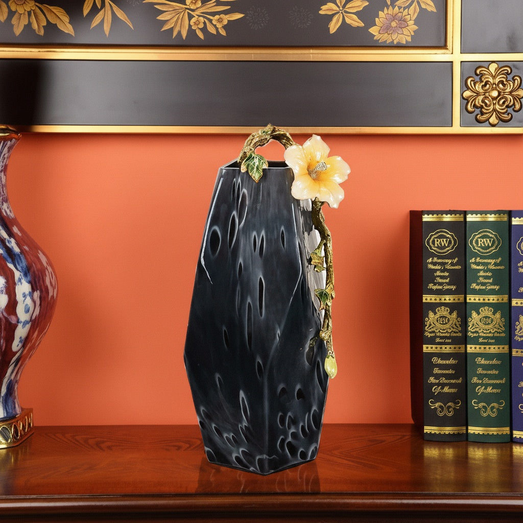 Front view of textured indigo ceramic vase with gold floral branch accent