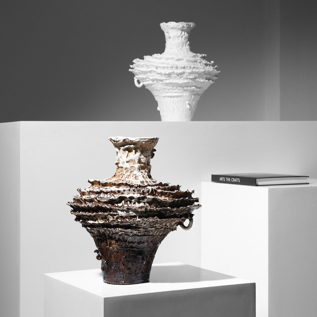 Group shot of white and brown ceramic vases