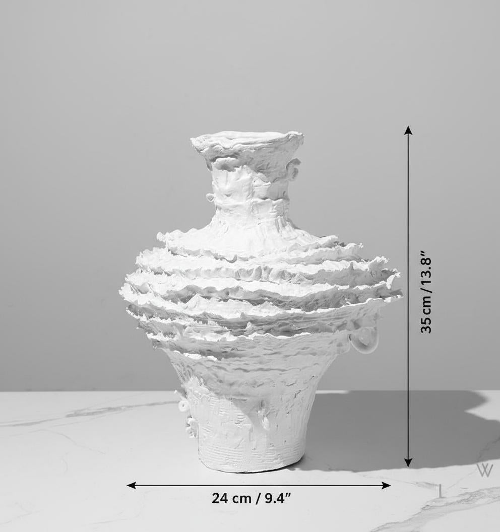 Front view of matte white layered vase