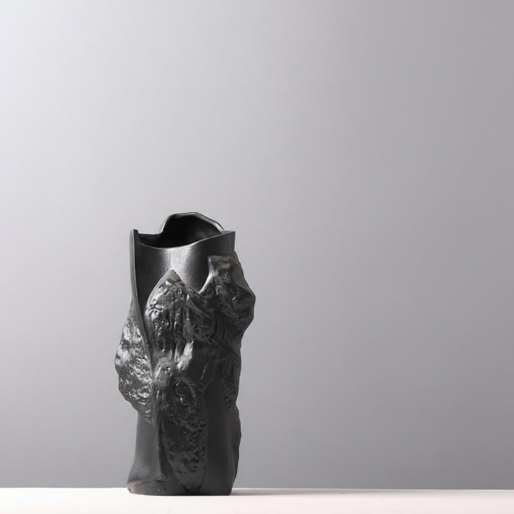 Black and white ceramic vases laying horizontally