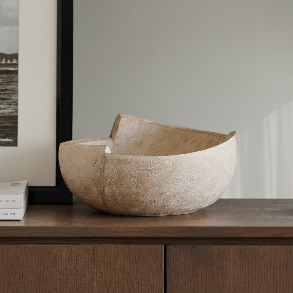 Angled view of stone-effect resin bowl highlighting rough texture