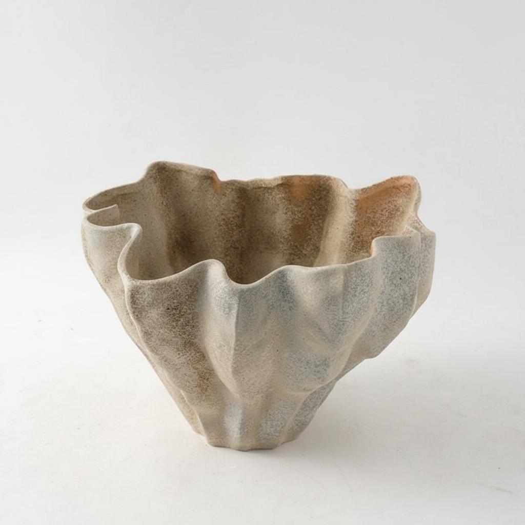 Front view of textured sand ceramic organic wave bowl