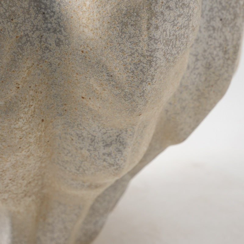 Detail of mottled beige ceramic surface texture