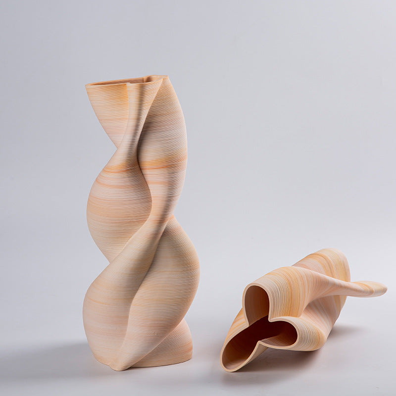 Textured sand ceramic vase with twisted helical shape front view
