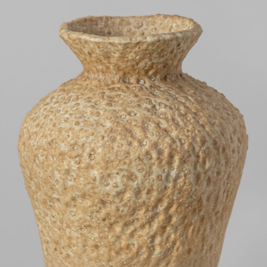 Close up of textured ceramic vase neck