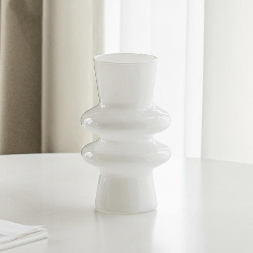 White tiered glass vase on a white table