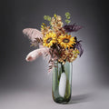 Tinted Glass Cylindrical Vase With Flowers