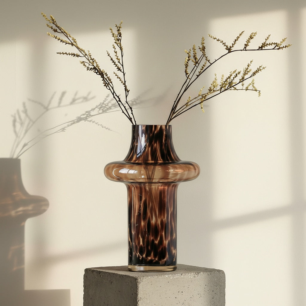 Large glass vase styled with dried botanicals