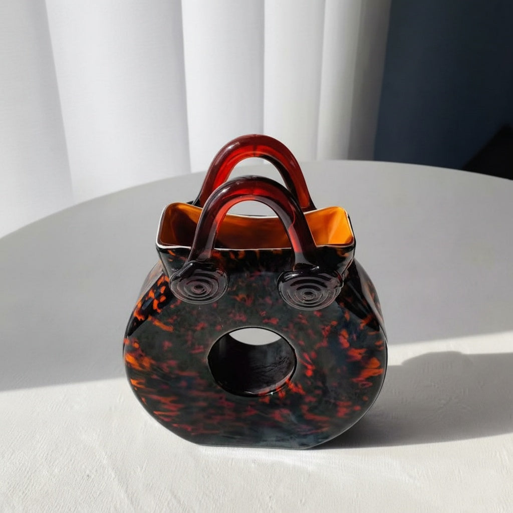Front view of tortoiseshell glass handbag vase