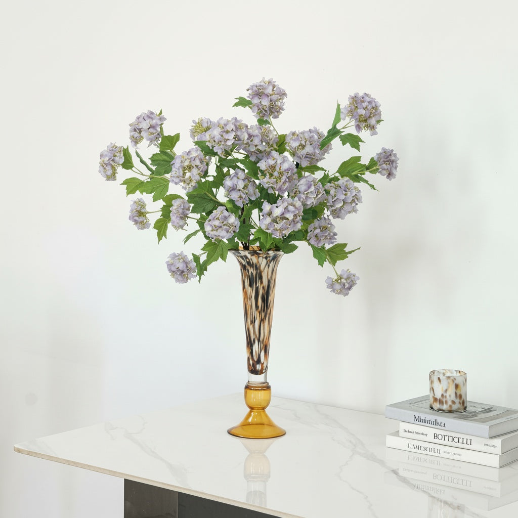 Tortoiseshell Glass Tall Trumpet Vase with Purple Flowers