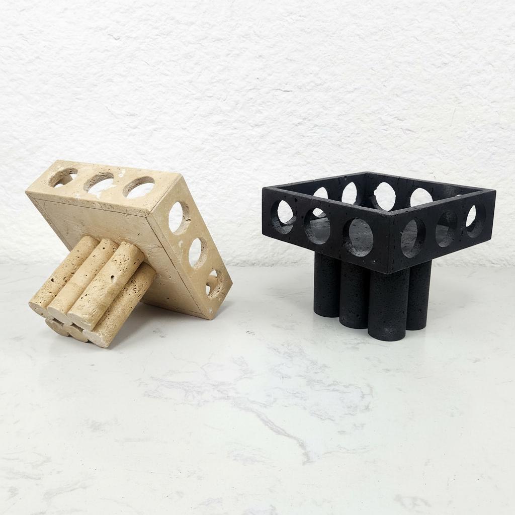 Beige travertine and black stone architectural bowls side by side